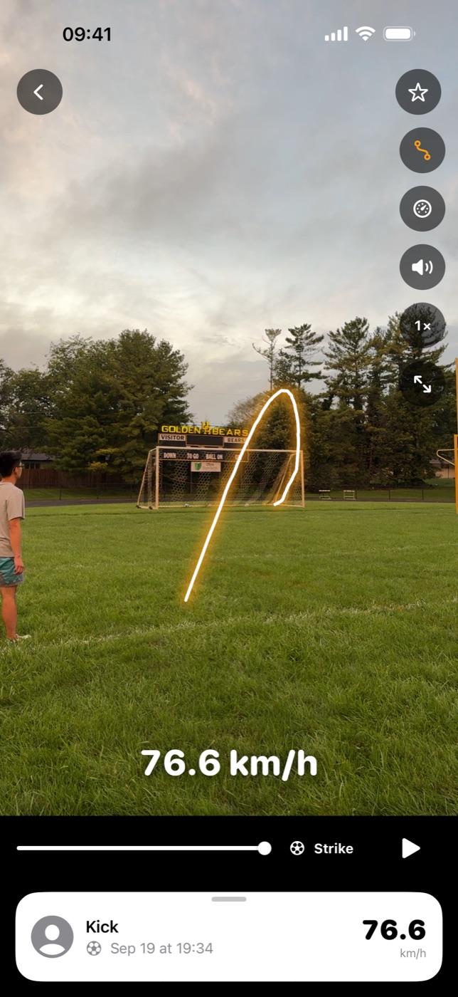 Strikr's replay of a kick: the ball's flight traced in amber over the trees and down into the goal, with 76.6 km/h along the bottom.